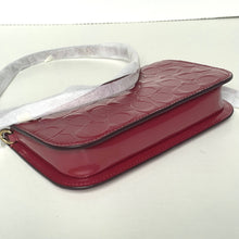 Load image into Gallery viewer, Red textured clutch bag on a white background