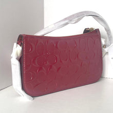 Load image into Gallery viewer, Red handbag with white strap on a light gray background
