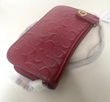 Load image into Gallery viewer, Red handbag with a visible brand logo on a white surface