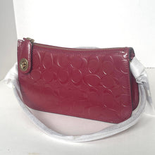 Load image into Gallery viewer, Pink handbag with a white strap on a light gray background