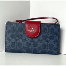 Load image into Gallery viewer, Coach wallet with red flap on a white background