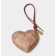 Load image into Gallery viewer, Heart-shaped pouch with a strap on a light gray background