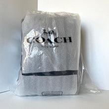 Load image into Gallery viewer, Coach New York bag in clear plastic packaging on a white background