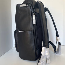 Load image into Gallery viewer, Black backpack with a white and gray patterned pouch on a white background