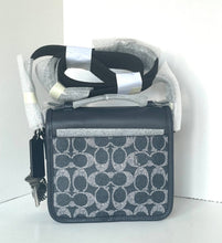 Load image into Gallery viewer, Black and white patterned handbag with a strap on a white background