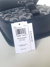 Load image into Gallery viewer, Coach handbag with a visible tag on a light gray background