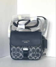 Load image into Gallery viewer, Coach handbag with patterned design on a white background