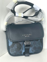 Load image into Gallery viewer, Coach handbag with floral pattern on a white background