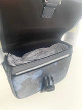 Load image into Gallery viewer, Gray bag with a mesh pocket on a light beige background