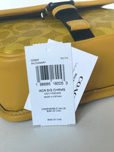 Load image into Gallery viewer, Yellow handbag with a price tag on a light gray background