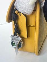 Load image into Gallery viewer, Keychain with keys attached to a yellow leather bag on a white background