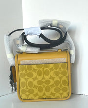 Load image into Gallery viewer, Yellow patterned handbag with a strap on a white background