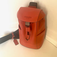 Load image into Gallery viewer, Red backpack with visible &#39;Coach&#39; logo on a white background