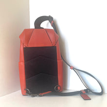 Load image into Gallery viewer, Red backpack with a black strap on a white background