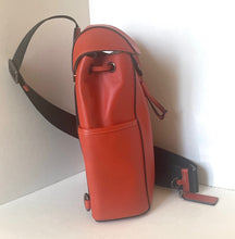 Load image into Gallery viewer, Red leather bag with a strap on a white surface