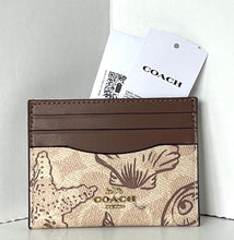 Load image into Gallery viewer, Coach cardholder with a patterned design on a white background