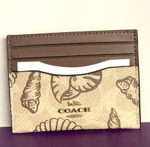 Load image into Gallery viewer, Coach cardholder with butterfly pattern on a purple surface