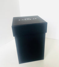 Load image into Gallery viewer, A black rectangular Coach gift box with the Coach logo printed in white on the lid, set against a plain white background.