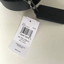 Load image into Gallery viewer, Coach travel pouch with a tag on a light gray background