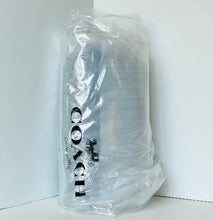 Load image into Gallery viewer, A clear plastic bag containing a gray cylindrical item with large black vertical text reading 'COOL' and smaller text below, photographed against a plain white corner background.