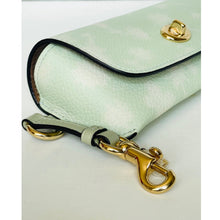 Load image into Gallery viewer, Light green clutch bag with gold hardware on a white background