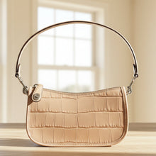 Load image into Gallery viewer, Beige handbag with a textured pattern on a light background