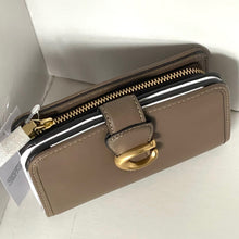 Load image into Gallery viewer, Brown wallet with gold accents on a white surface