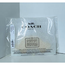 Load image into Gallery viewer, Coach New York product packaging with clear plastic wrap on a gray background