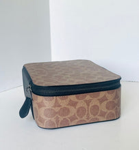 Load image into Gallery viewer, Beige and black travel case with zipper on a white background