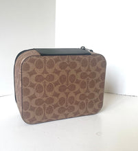 Load image into Gallery viewer, Brown patterned travel case on a white background