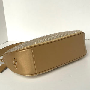 Gold handbag with rhinestone embellishments on a white background