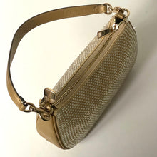 Load image into Gallery viewer, Gold handbag with textured surface and visible brand logo on a light background