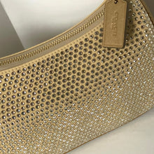 Load image into Gallery viewer, Gold clutch bag with rhinestone embellishments and a visible brand tag.