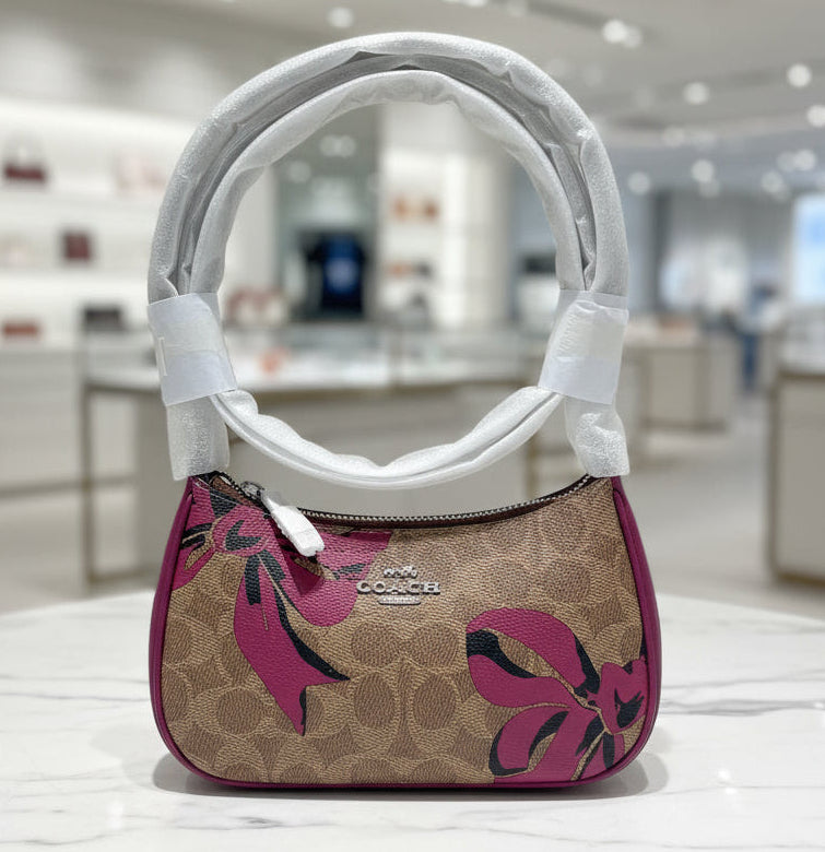 Handbag with floral design on a white background