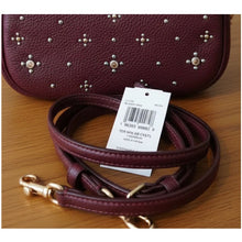 Load image into Gallery viewer, Maroon leather handbag with studs and matching leash on a wooden surface