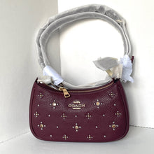 Load image into Gallery viewer, Maroon handbag with gold studs on a white background