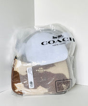 Load image into Gallery viewer, A Coach New York handbag in clear plastic packaging, showing a light blue upper section and a brown and beige patterned lower section.