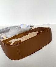 Load image into Gallery viewer, A rectangular brown leather and cowhide haircoat bag with a gray fabric lining, shown on a plain white background.