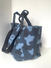 Load image into Gallery viewer, Blue camouflage tote bag with black handles and strap on a white background