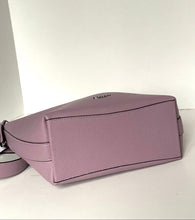 Load image into Gallery viewer, A dusty purple pebbled leather shoulder bag shown from a side angle against a plain white background.
