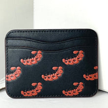 Load image into Gallery viewer, Black cardholder with red floral patterns on a white surface