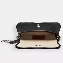 Load image into Gallery viewer, Black leather clutch bag with beige interior on a white background