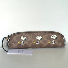 Load image into Gallery viewer, Coach pencil case with Snoopy Woodstock design on a white background