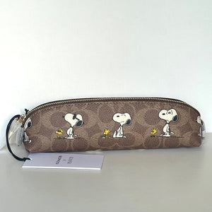 Coach pencil case with Snoopy Woodstock design on a white background