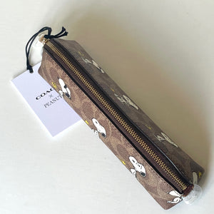 Brown pencil case with gold zipper and 'COach' tag with snoopy and woodstock background