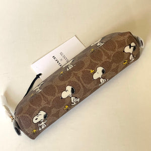 Pencil case with Snoopy woodstock design on a beige background