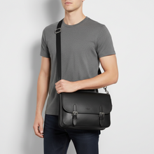 Load image into Gallery viewer, Black shoulder bag on a mannequin with a white background