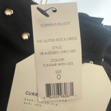 Load image into Gallery viewer, Clothing tag with product details on a garment