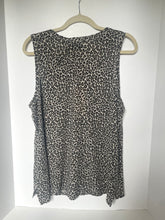 Load image into Gallery viewer, Leopard print sleeveless top on a hanger against a white background