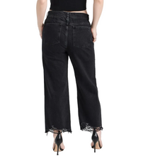 Load image into Gallery viewer, Black wide-leg jeans worn by a person on a white background